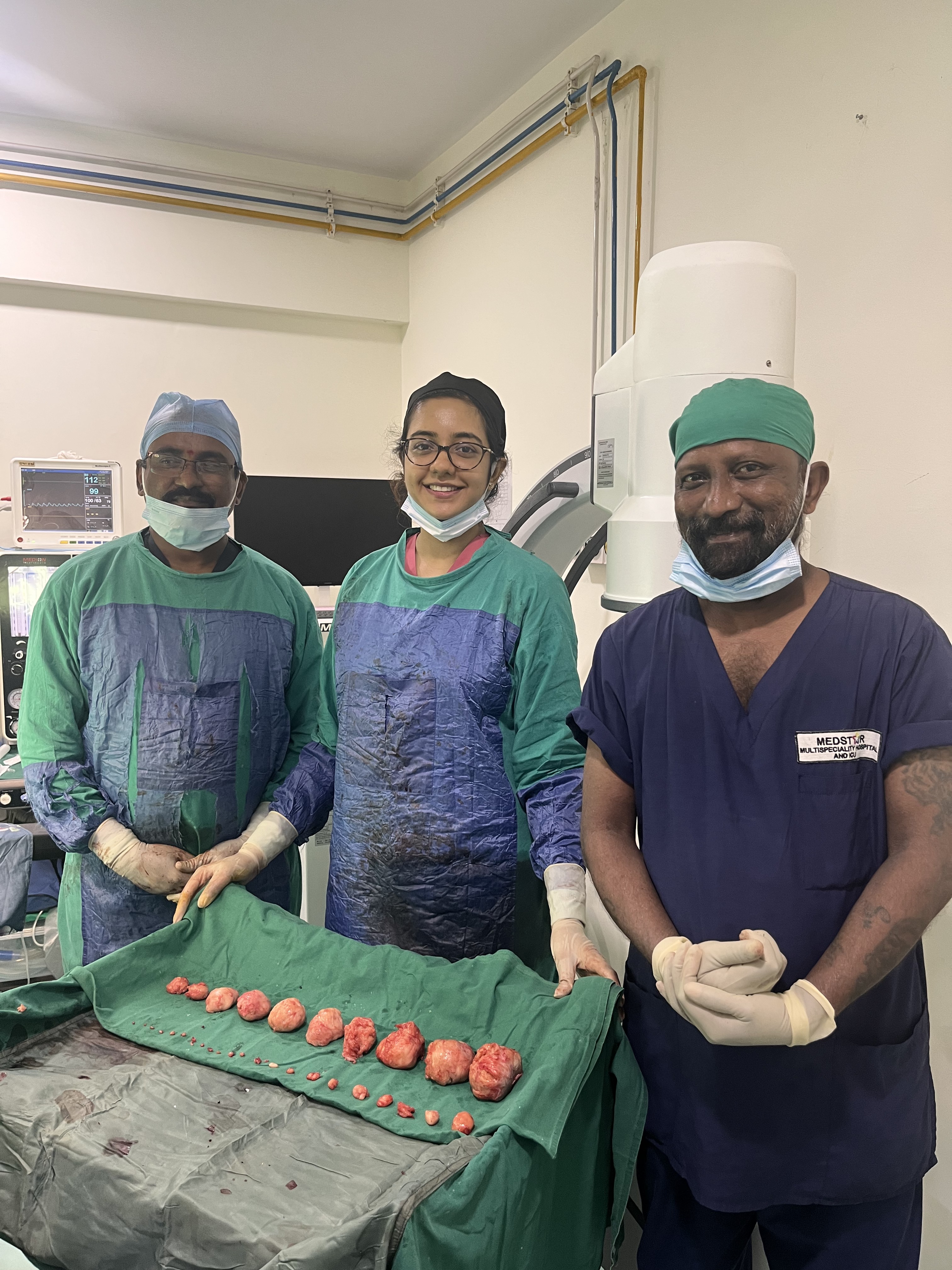Dr. Sejal Kulkarni and surgical team in the OR showing multiple successfully removed uterine fibroids